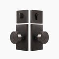 Entry door knob set with deadbolt and rectangular backplate in brushed gold finish, SENY